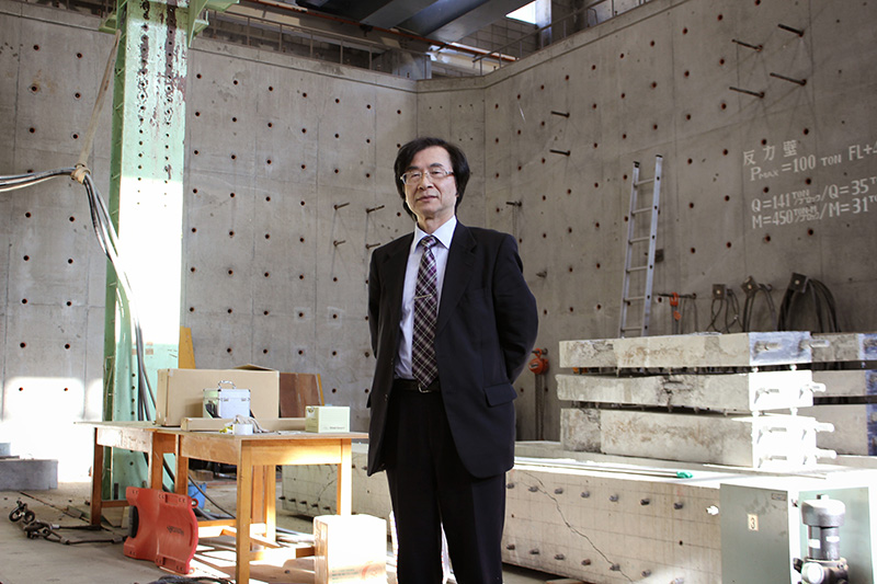 Maruyama standing in concrete walled room