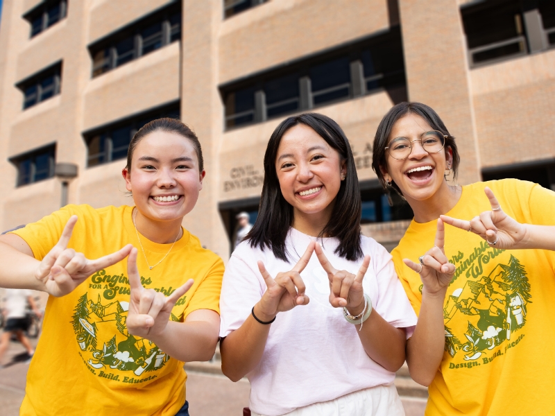 Texas CAE students doing hook 'em horns in Gone to Engineering tshirts