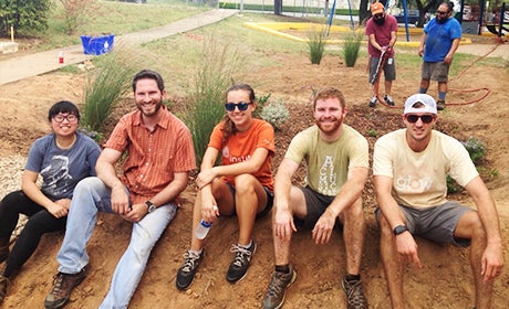 Texas Engineering Brandon Klenzendorf smiling with students
