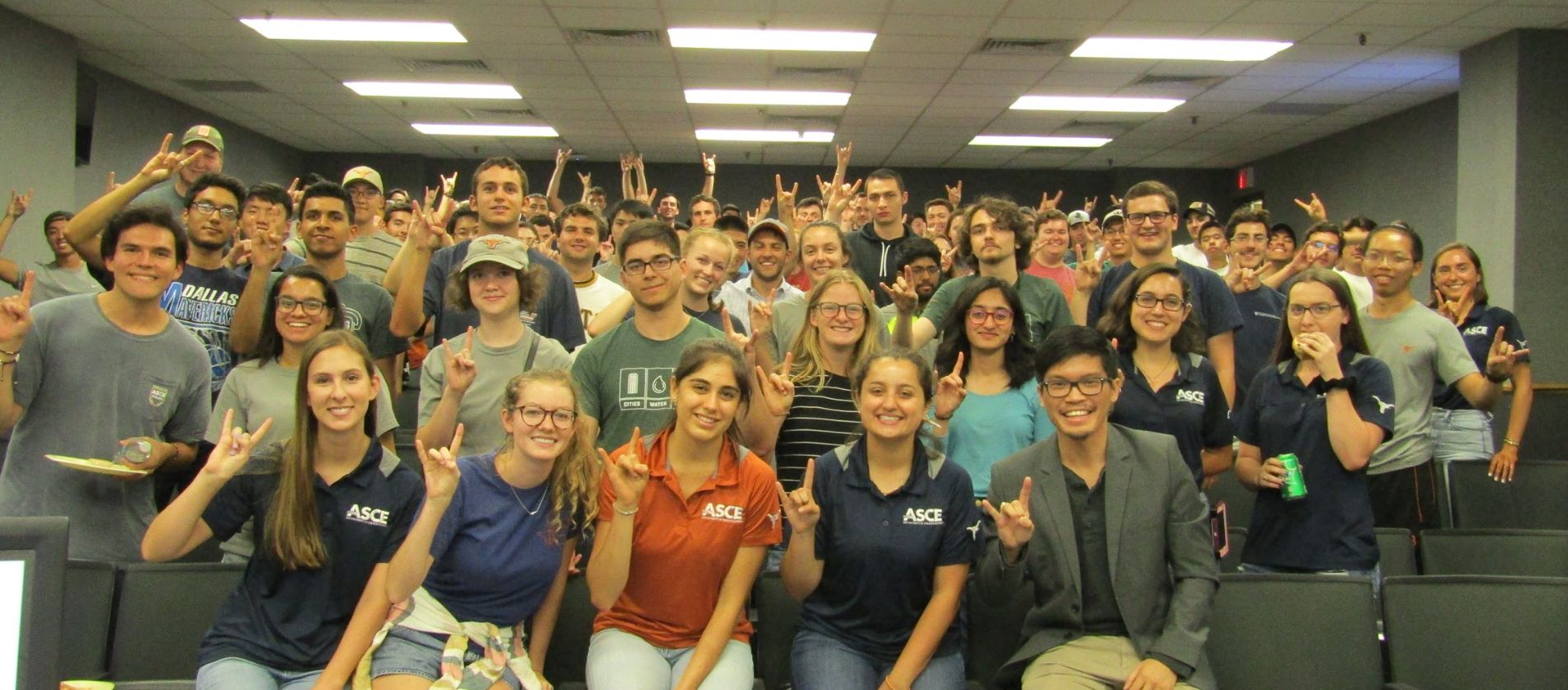Texas Engineering students wearing ASCE shirts smiling in a group