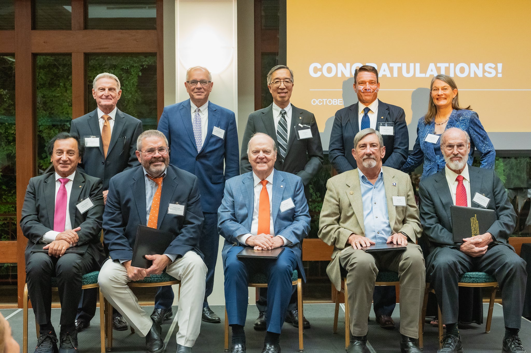 Texas Engineering alumni smiling with awards at the Academy of Distinguished Alumni banquet