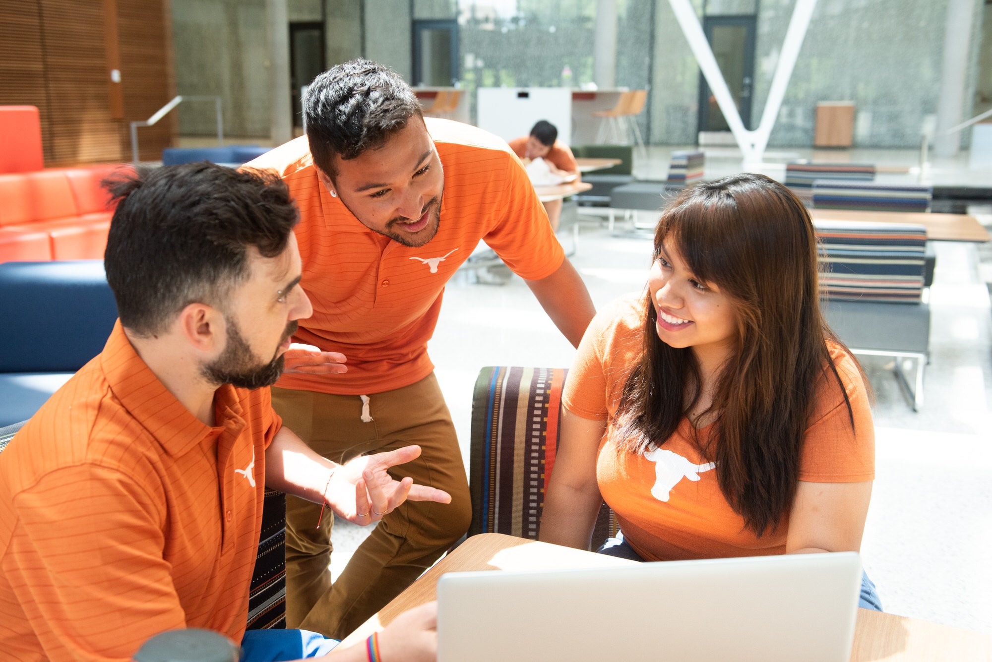 Students talking during research for the CLEAR homes committee studying air quality