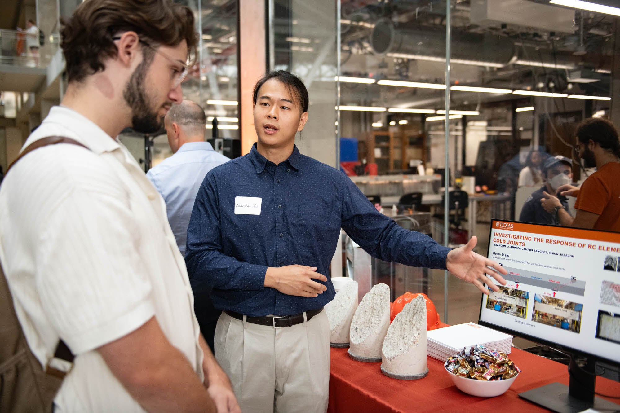 Graduate student presenting research on cold joint concrete