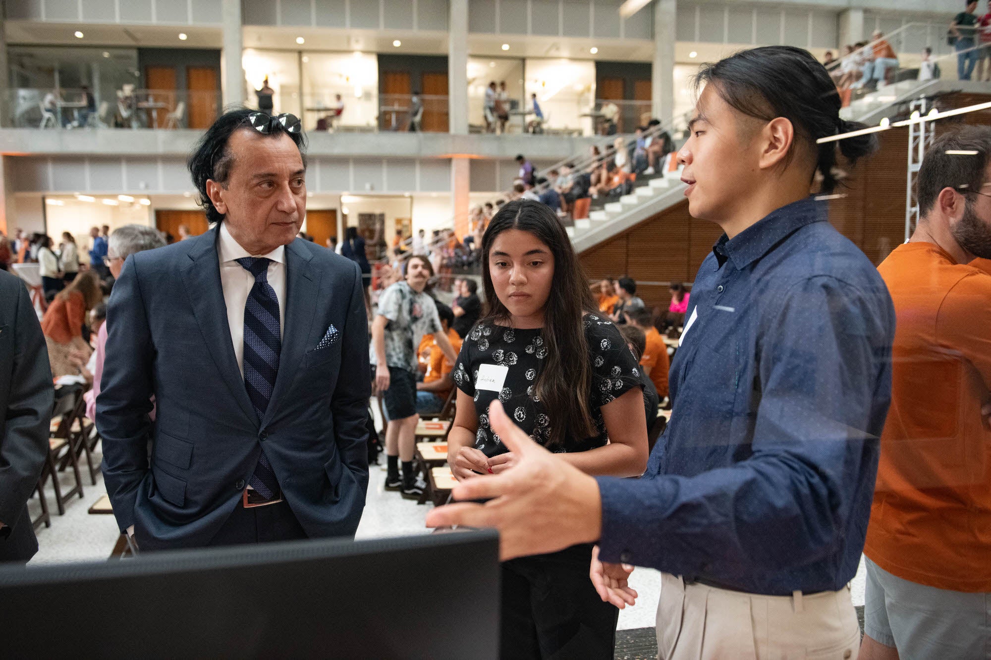 Student presents research to Maseeh Fariborz during the naming ceremony for the department.