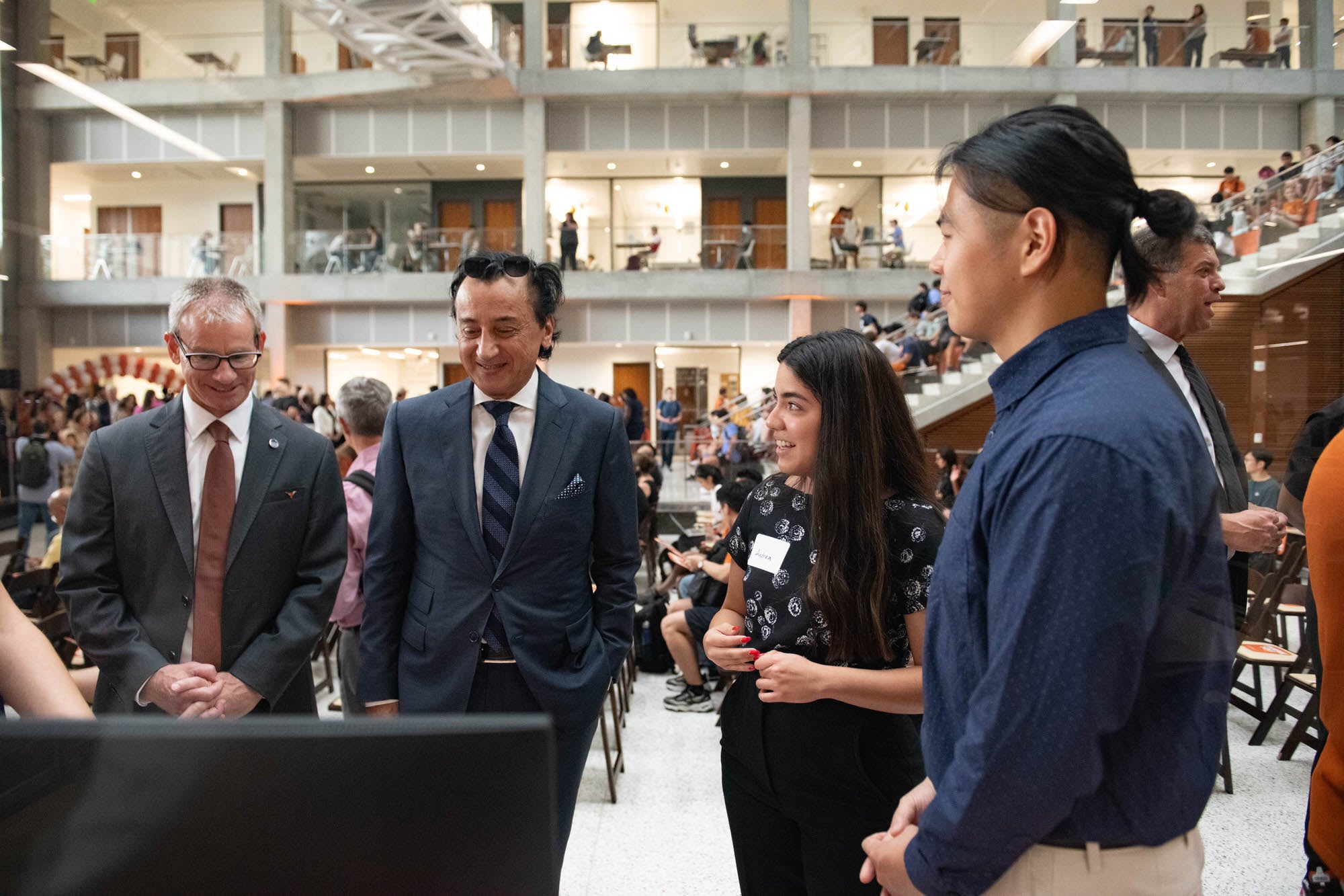 Student presents research to Maseeh Fariborz during the naming ceremony for the department.