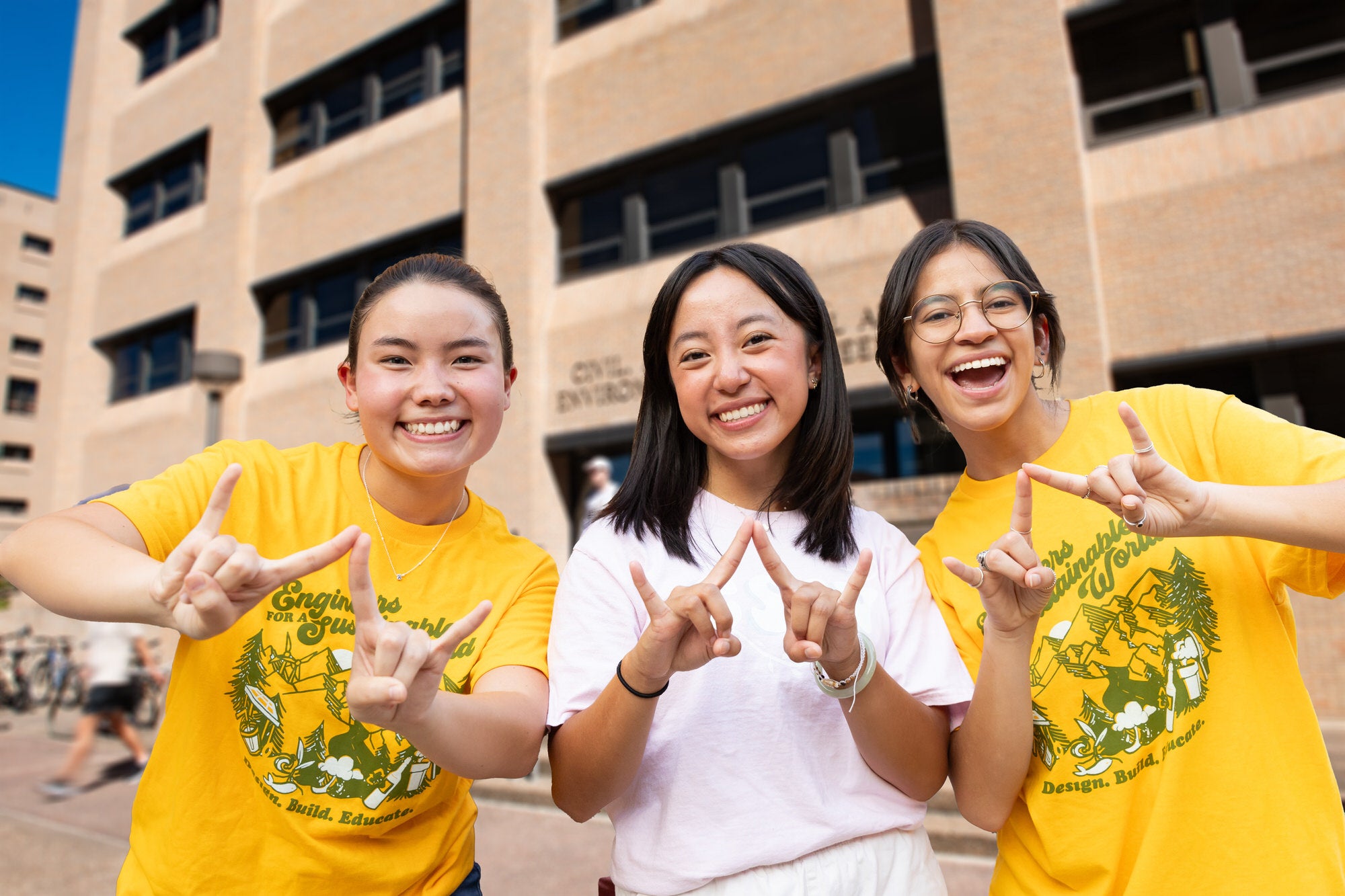 Students smiling at Gone to Engineering event wearing Engineers for a Sustainable World tshirts