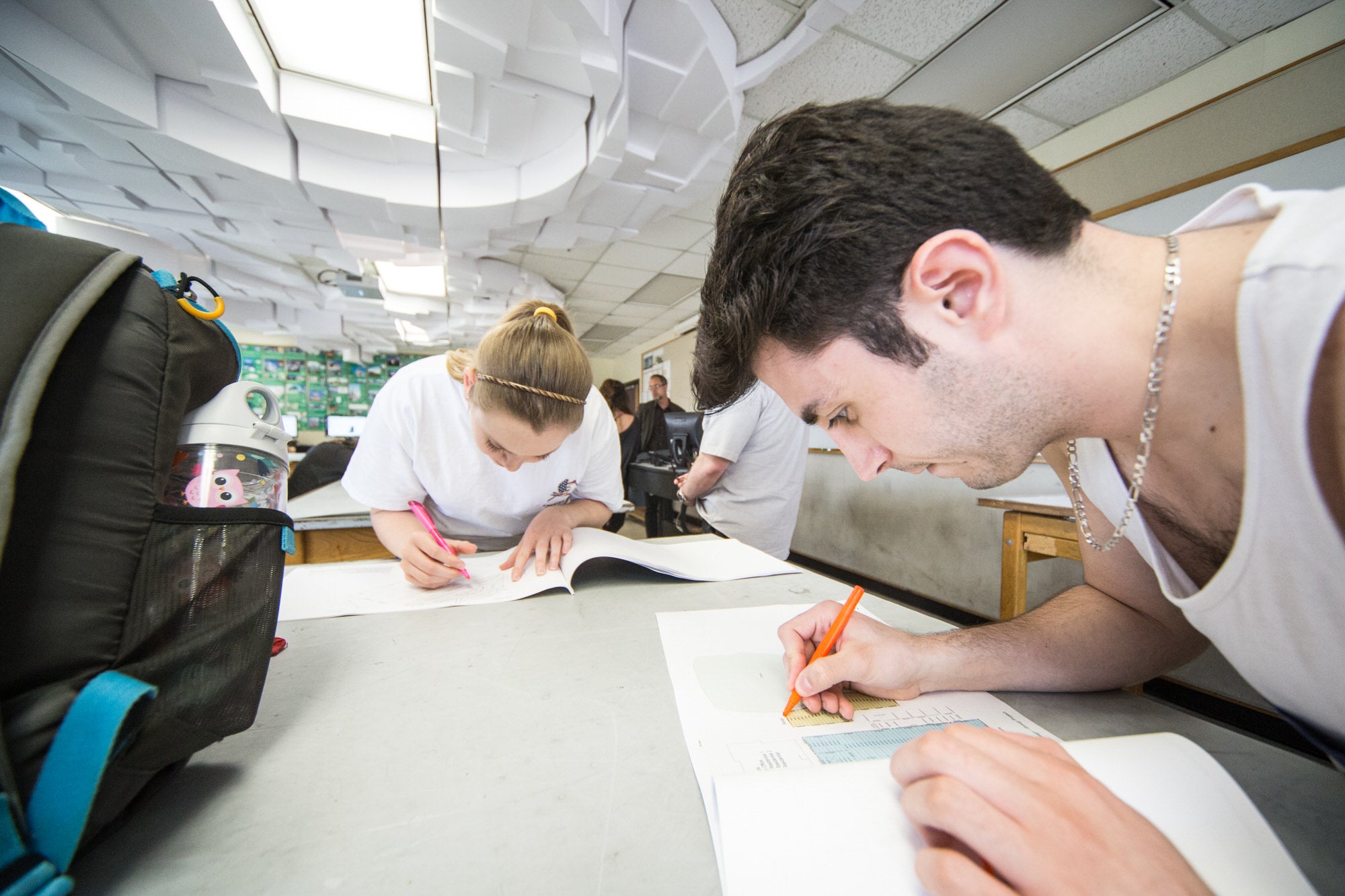 CAEE students drafting plans in class