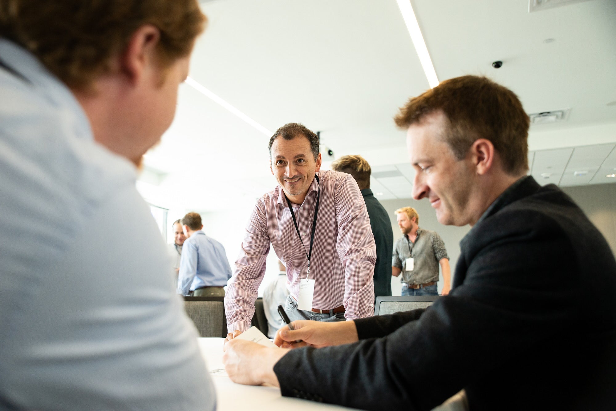 UT Austin faculty talking at table