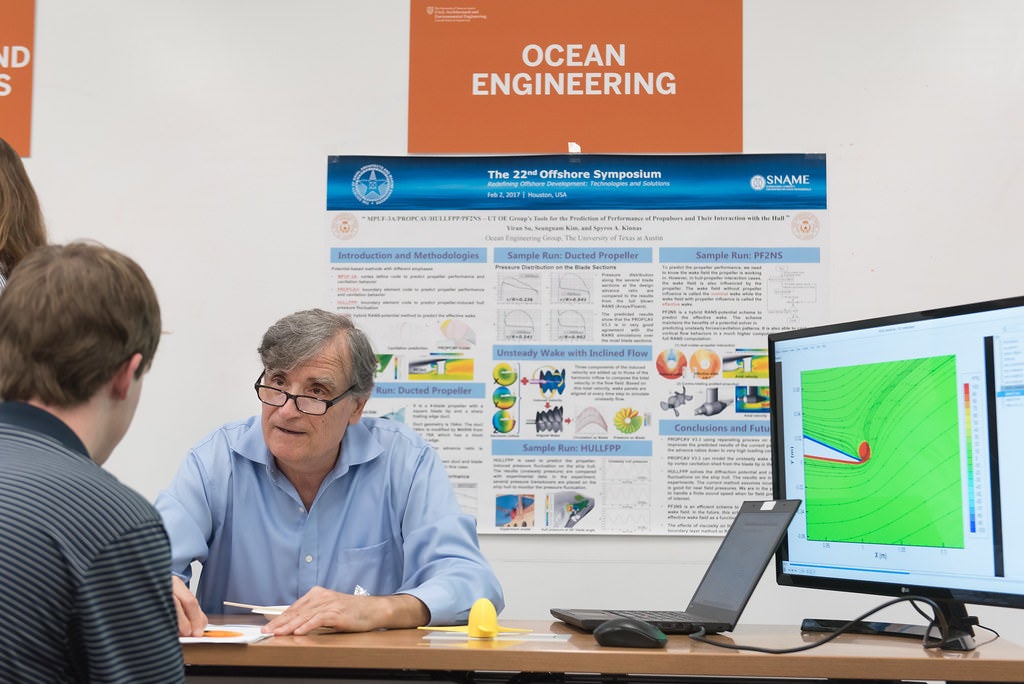 Faculty presenting research to student during Industry Fair Techinical breakouts for Ocean Engineering