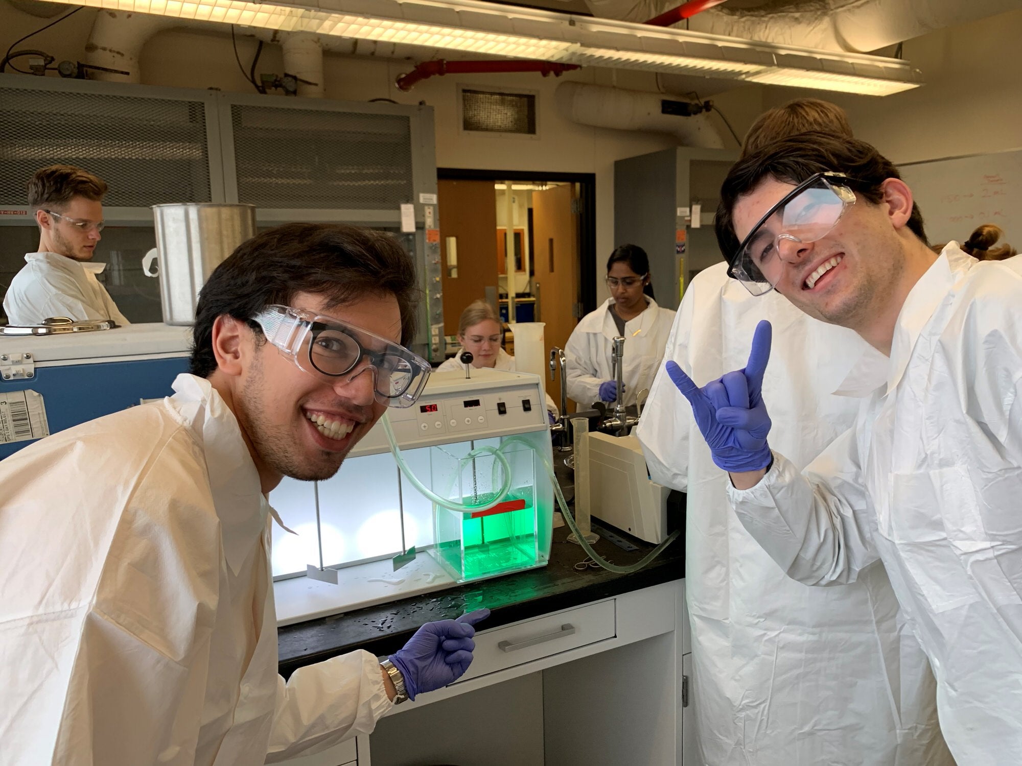 Student in environmental water lab with a hook em