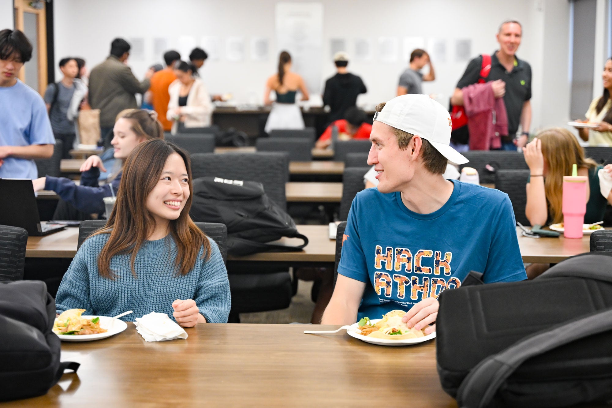 CAEE Hackathon students having lunch while they work