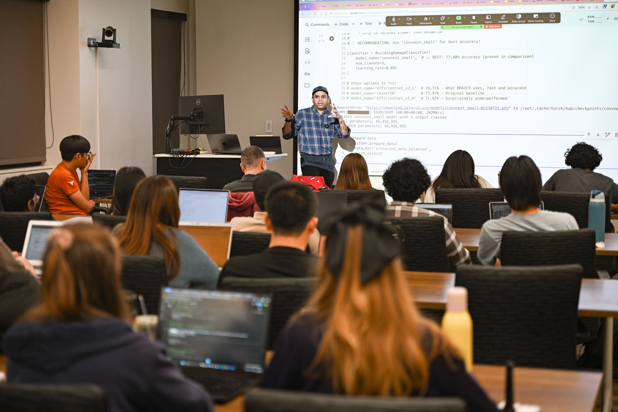 Texas CAEE hackathon with students at computers and professor at the front