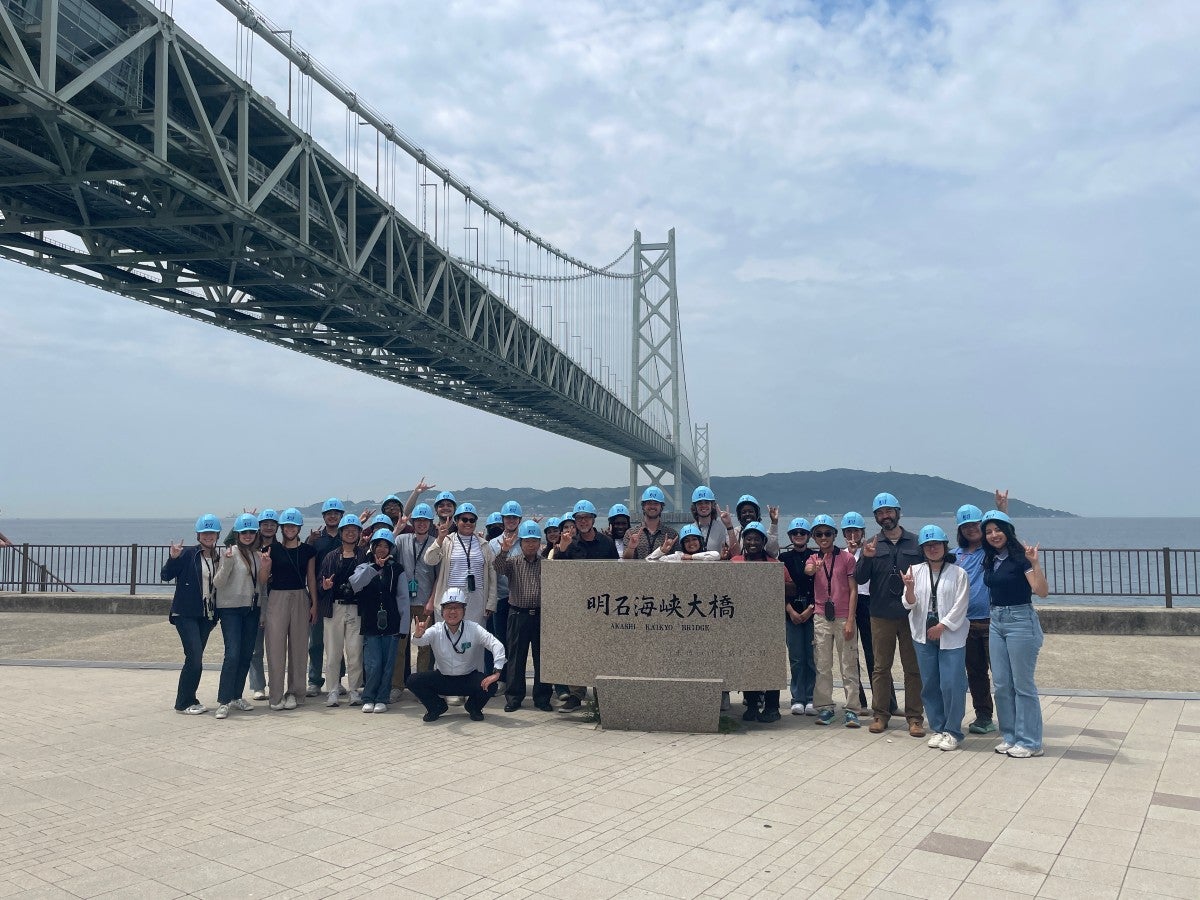 A cohort of UT students and Professor of Practice Gregory Brooks, tour the Akashi Kaikyo bridge with Satoshi Kashima while in Japan for the Emerging Technologies study abroad program. 