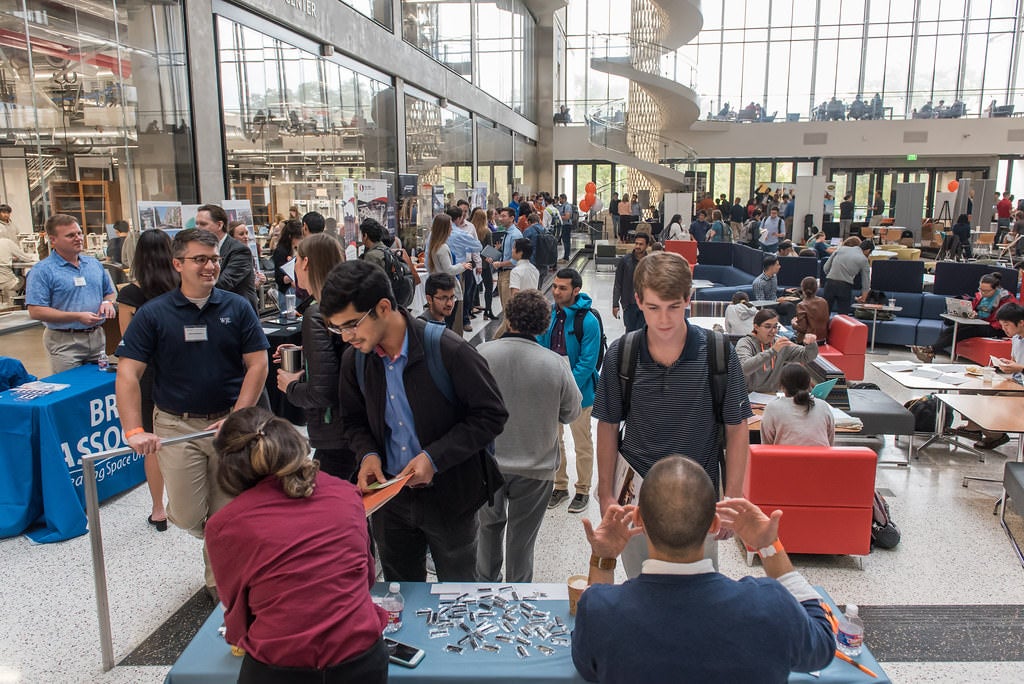 Texas Engineering students and recruiters talking at indurty open house event