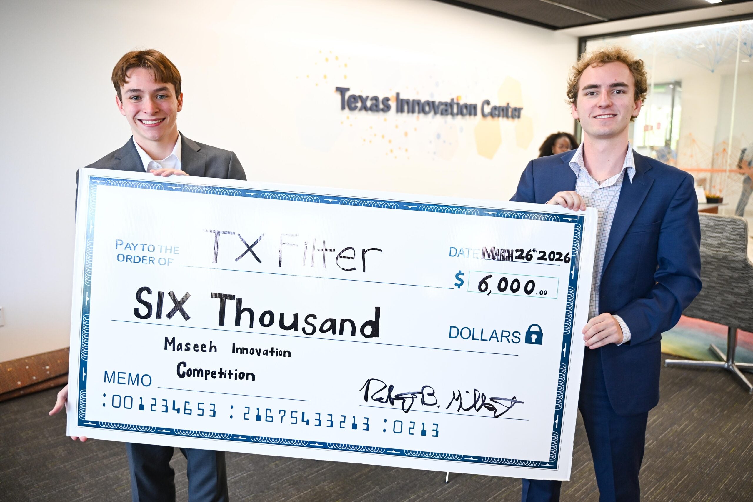 UT students Evan Segura and Jacob Lucia pose with Maseeh Compeution prize check