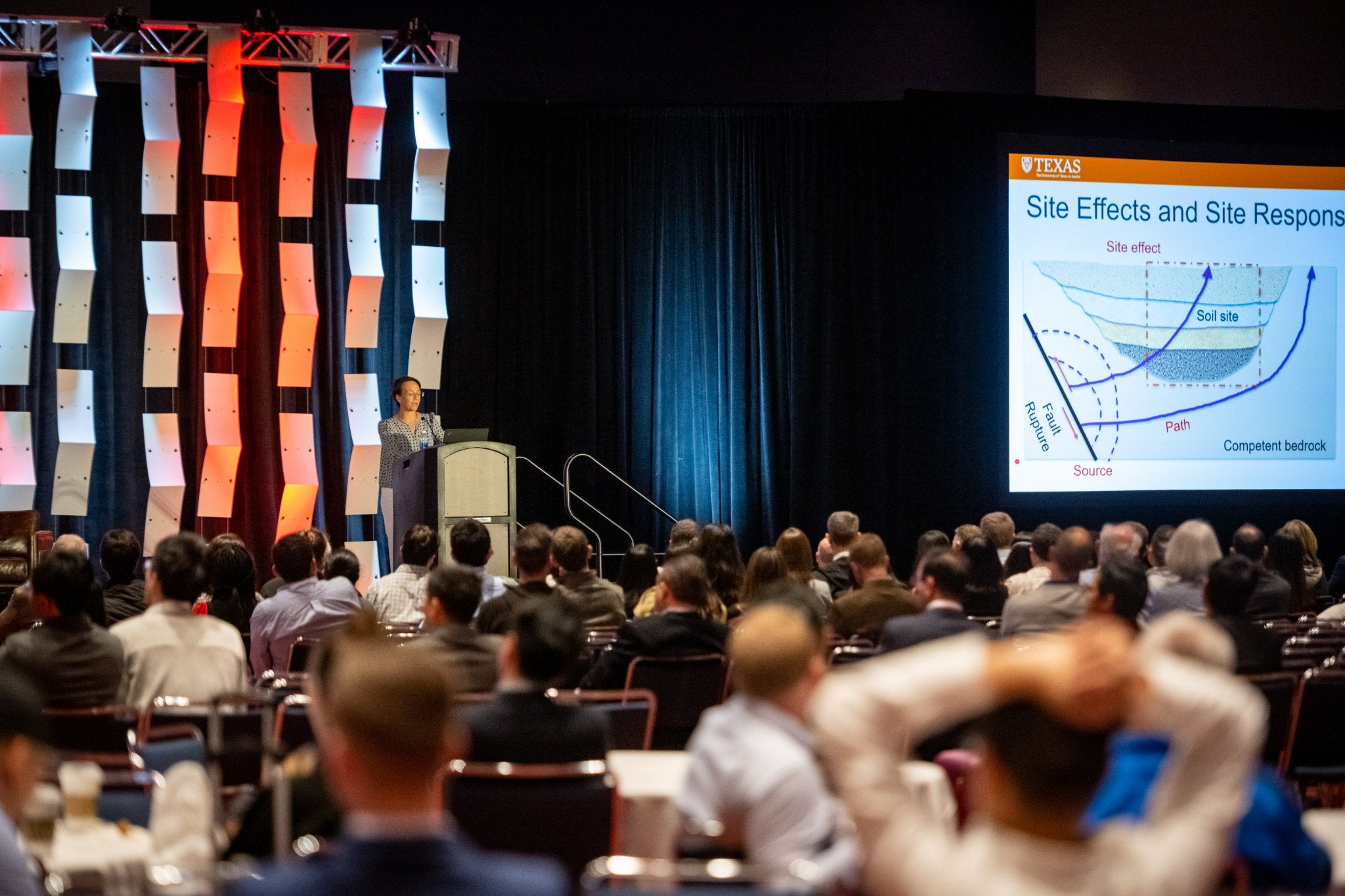 Texas Engineer Ellen Rathje speaking at podium in front of large crowd